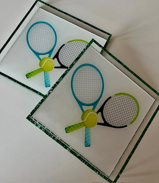 An acrylic square tray with green edging, featuring a miniature representation of a tennis racket and a tennis ball.