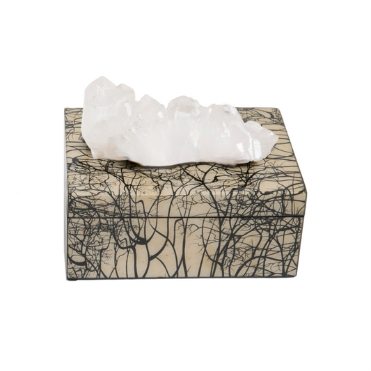 A decorative lacquer box with a semi precious crystal, featuring a black and white abstract pattern and a removable lid.