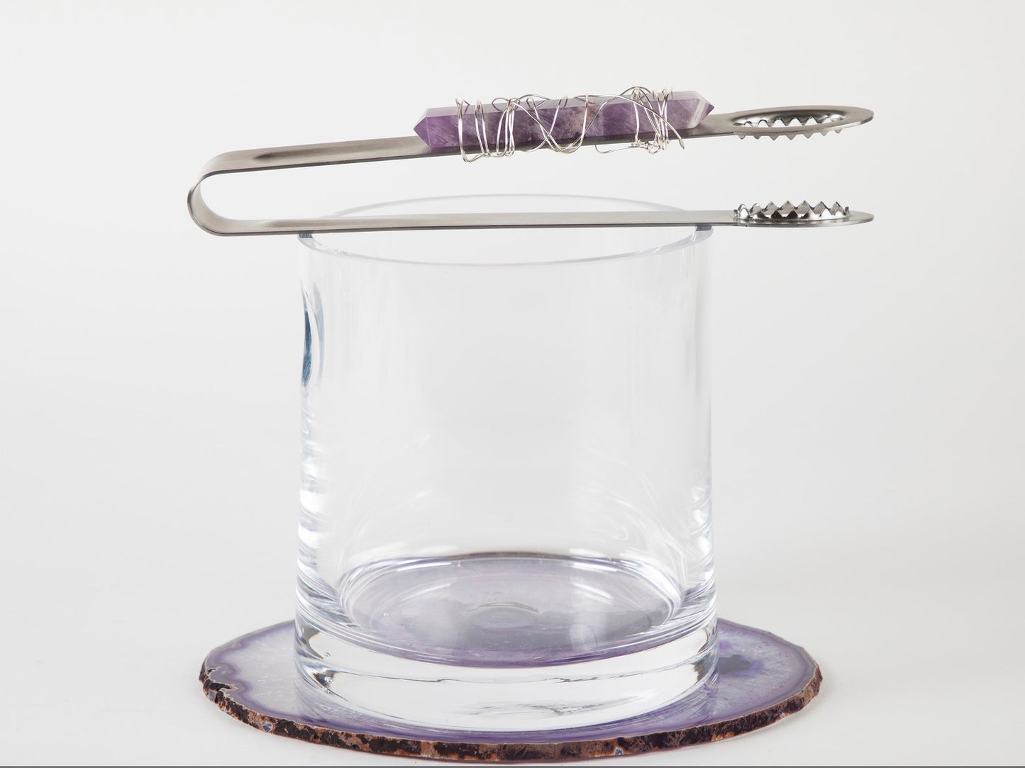 tongs with amethyst and wire on glass ice bucket