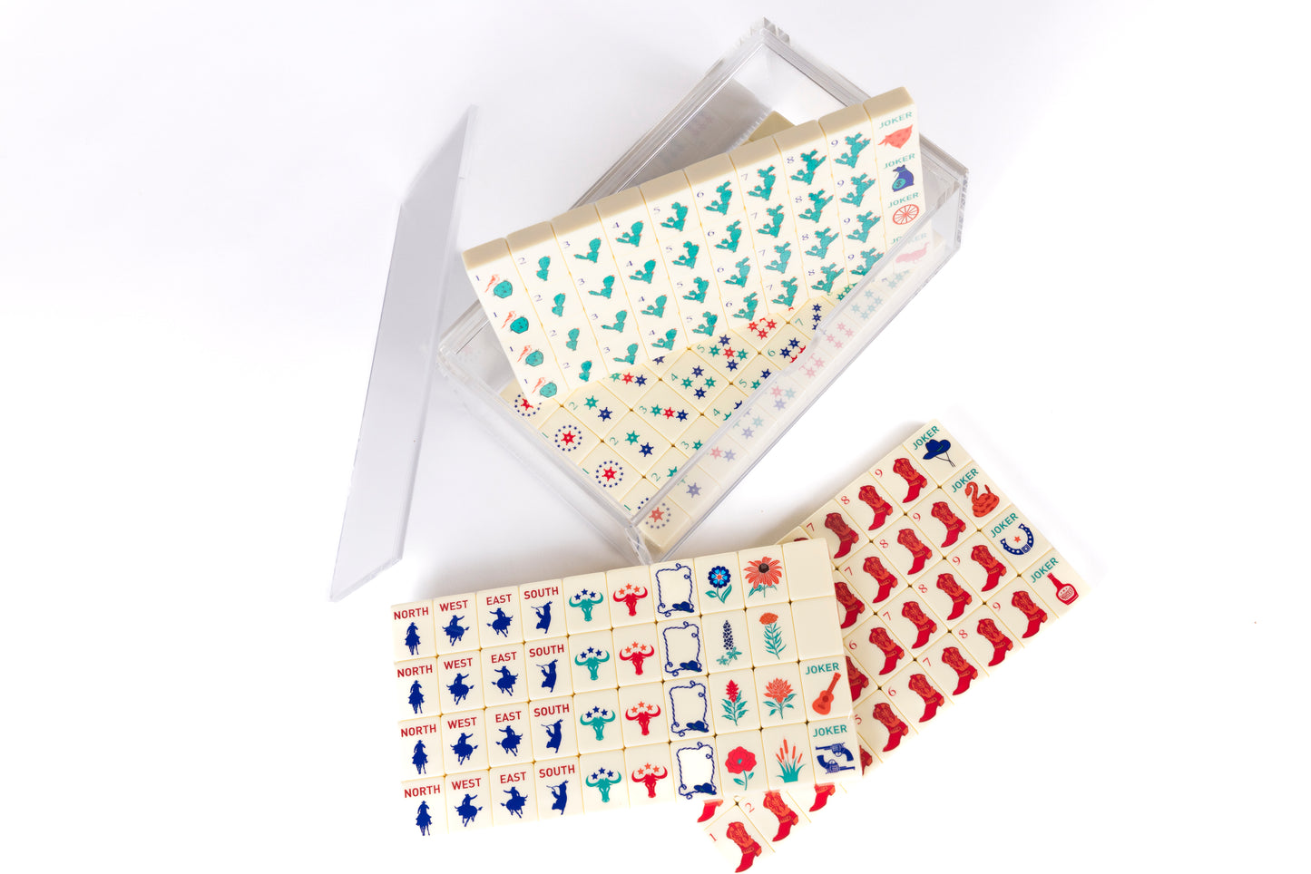 mahjong cowboy set on cream tiles. Set is beatifully stored in a clear acrylic box. 