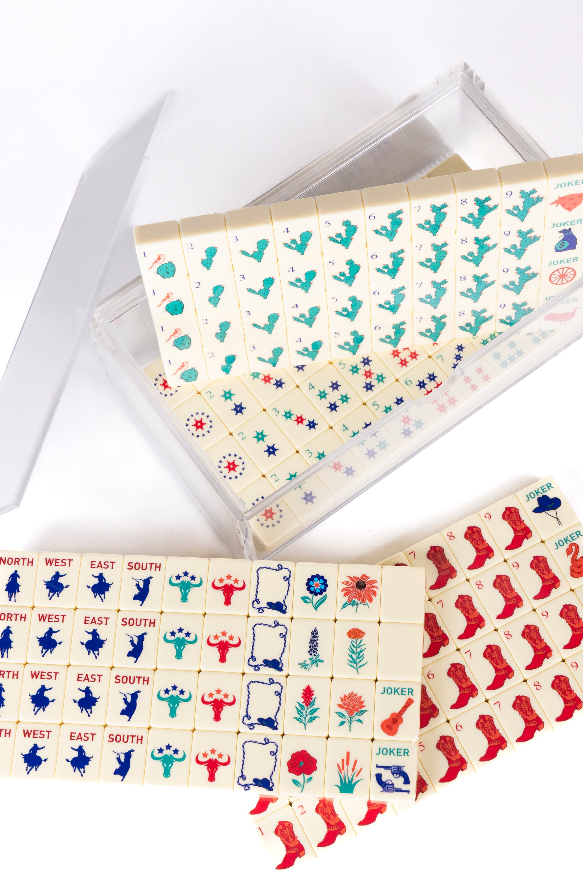 mahjong cowboy set on cream tiles. Set is beatifully stored in a clear acrylic box. 