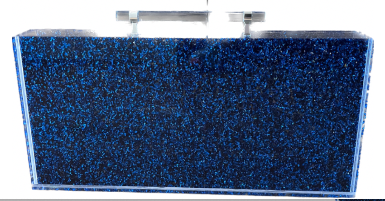 Blue glitter acrylic Mahjong set with components neatly arranged inside the box.