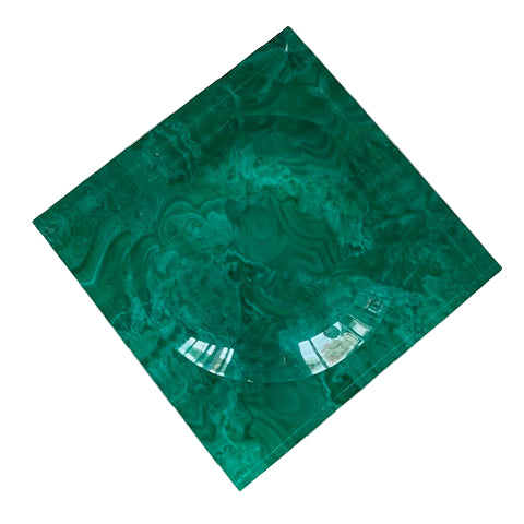 A green malachite acrylic candy tray with a marbled design.
