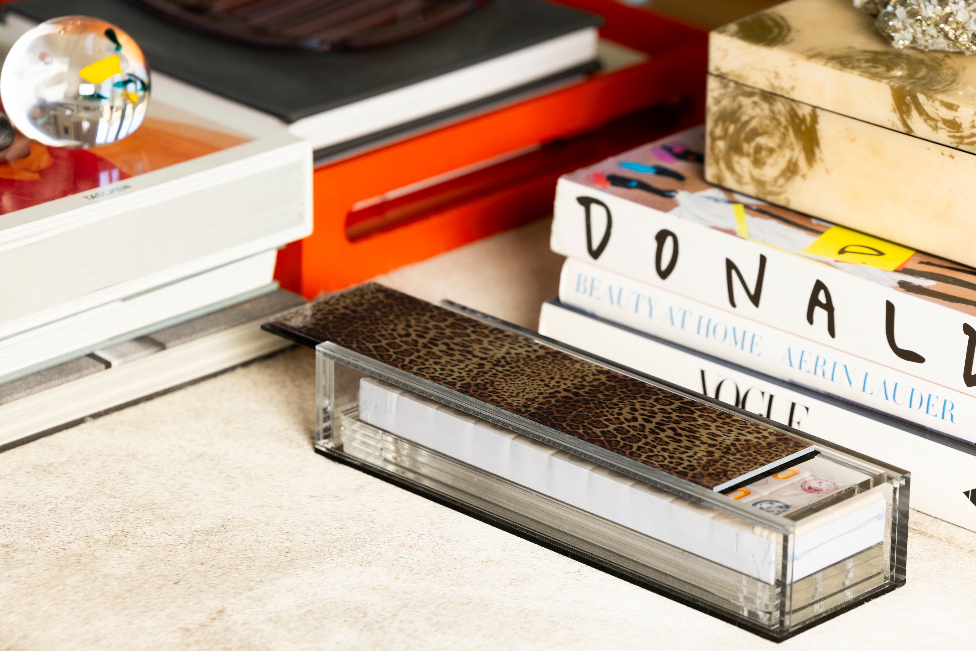 acrylic leopard rummikub set on table 