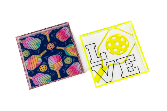 Two colorful items: an acrylic square and a 'LOVE' design with a yellow circle.
