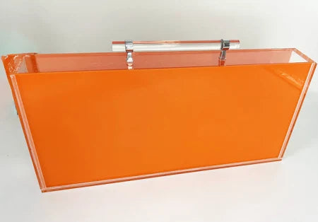 Orange acrylic Mahjong set with components neatly arranged inside the box.