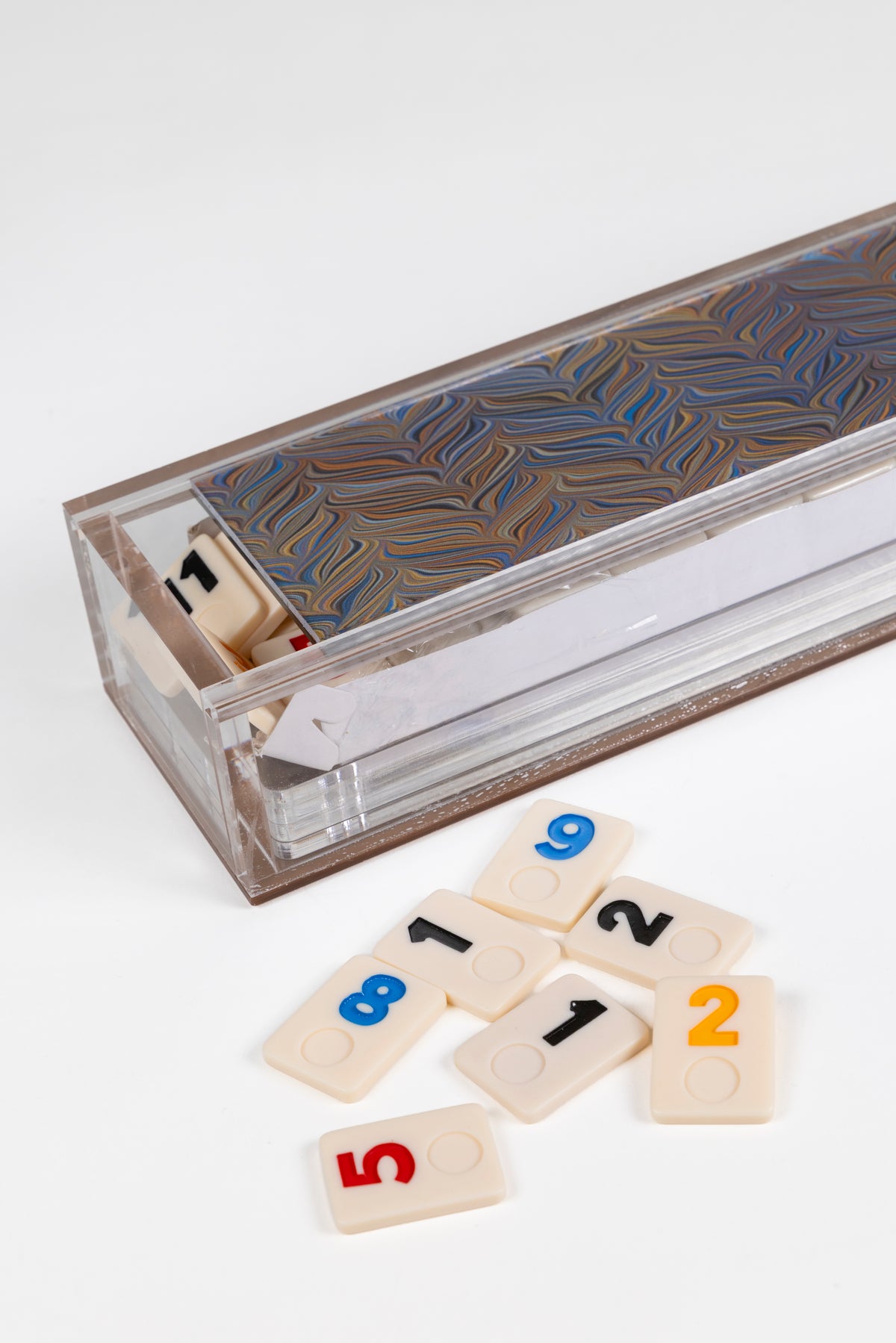 rummikub set in acrylic box with chevron pattern and tiles