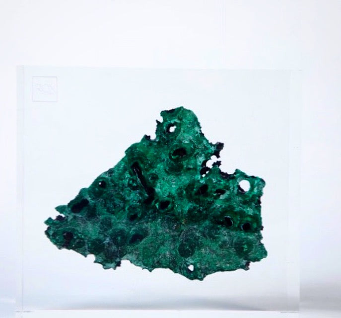 clear embedment with green crystal