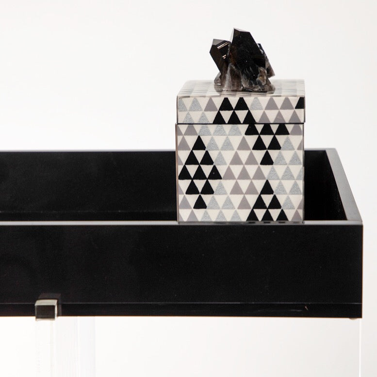 black pyramid with quartz on lacquer box