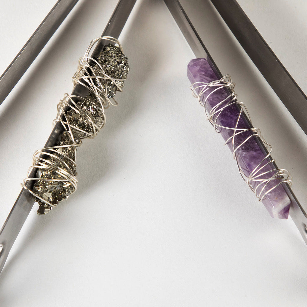 tongs wrapped in crystal with wire