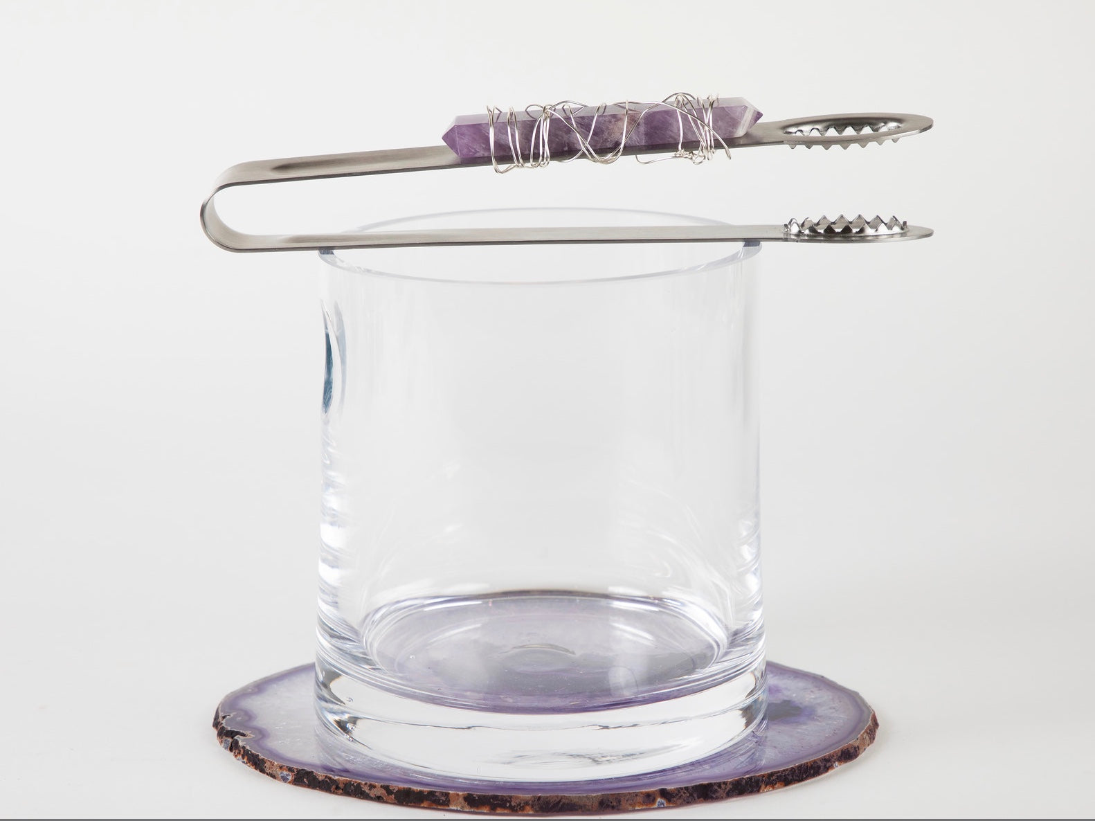 tongs with amethyst and wire on glass ice bucket